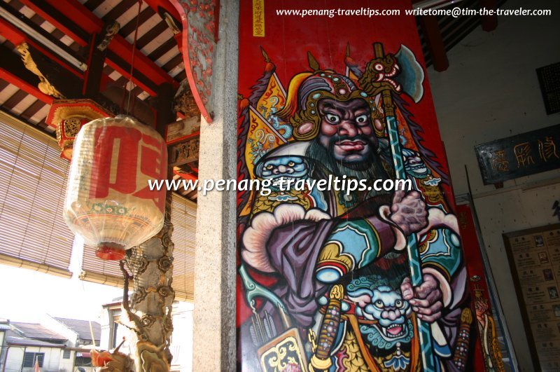 A menacing door god peers at visitors to Tan Kongsi