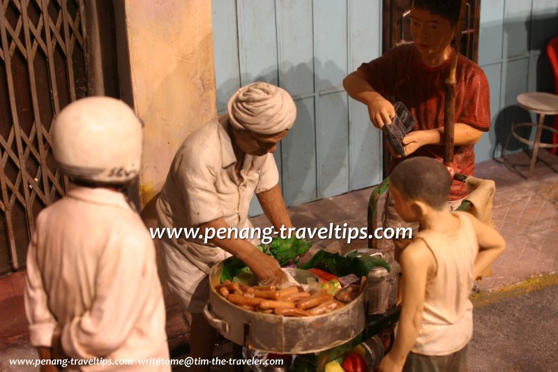Buying kuih from an Indian street vendor