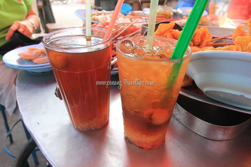 Lo Han Kuo drinks at the Pulau Tikus Market stall