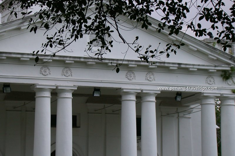 Gable-shaped roof and Grecian columns on the front façade of St George's Church