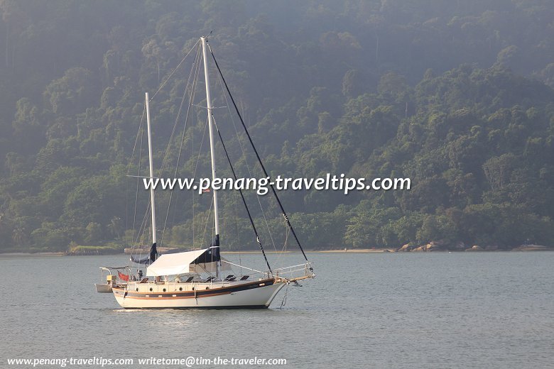 Yacht in the sea off Queensbay Coast, with Pulau Jerejak in the background